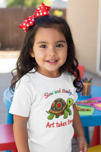 Close-up of Hispanic toddler girl wearing turtle tee