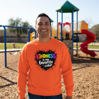 Hispanic male wearing orange Kindness sweatshirt at playground