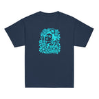 A navy blue short-sleeve crewneck t-shirt featuring a bright turquoise graphic on the chest of Frida Kahlo's face surrounded by flowers and the text 'Oh Frida GIVE ME COURAGE'.