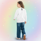 A female teen wearing an art sweatshirt with art shop logo on the back